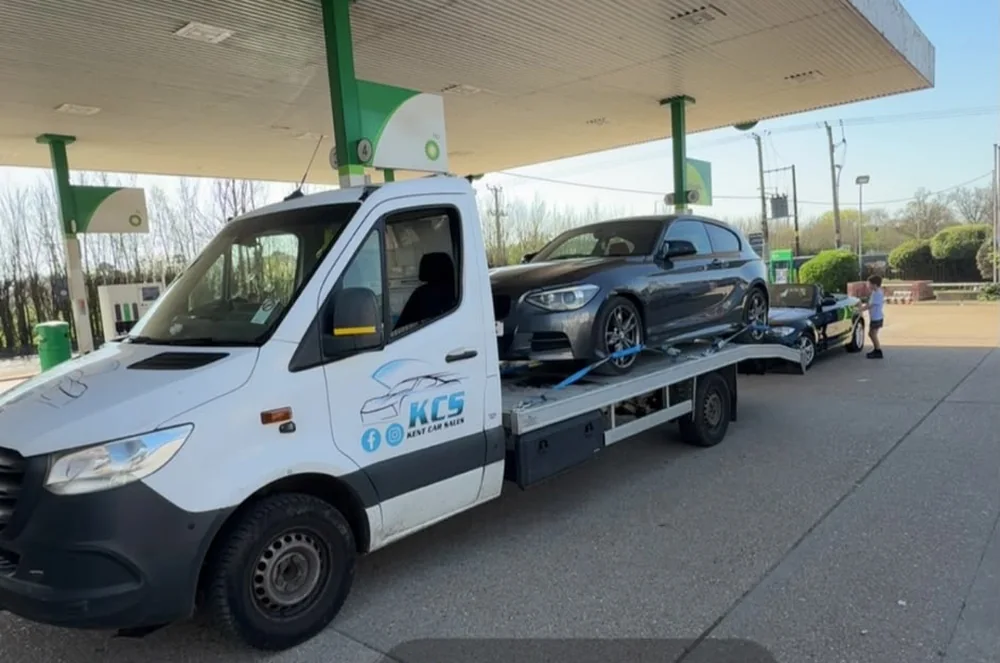 KCS Recovery truck carrying a BMW with a second car on the trailer during a long distance transport run